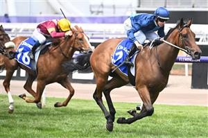 MELBOURNE, AUSTRALIA - NOVEMBER 03: Damian Lane riding Charm Stone winning Race 2, the Darley Ottawa Stakes during 2022 Kennedy Oaks Day at Flemington Racecourse on November 03, 2022 in Melbourne, Australia. (Photo by Vince Caligiuri/Getty Images)
