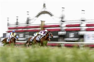 MELBOURNE, AUSTRALIA - NOVEMBER 03: Hugh Bowman rides Razeta to win race 4 the Off The Track Desirable Stakes during 2022 Kennedy Oaks Day at Flemington Racecourse on November 03, 2022 in Melbourne, Australia. (Photo by Darrian Traynor/Getty Images)