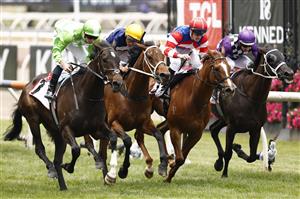 MELBOURNE, AUSTRALIA - NOVEMBER 03: James McDonald (left) rides Matron Bullwinkle to win race 1 the TCL TV Stakes during 2022 Kennedy Oaks Day at Flemington Racecourse on November 03, 2022 in Melbourne, Australia. (Photo by Darrian Traynor/Getty Images)