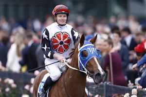 MELBOURNE, AUSTRALIA - NOVEMBER 03: Jamie McDonald returns to scale on Aitch Two Oh after winnin race 9 the Network 10 News Red Roses Stakes during 2022 Kennedy Oaks Day at Flemington Racecourse on November 03, 2022 in Melbourne, Australia. (Photo by Darrian Traynor/Getty Images)