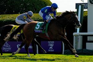 LEXINGTON, KENTUCKY - NOVEMBER 04: Jockey William Buck rides Mischief Magic to win the Breeders