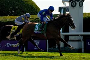 LEXINGTON, KENTUCKY - NOVEMBER 04: Jockey William Buck rides Mischief Magic to win the Breeders