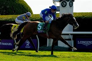 LEXINGTON, KENTUCKY - NOVEMBER 04: Jockey William Buck rides Mischief Magic to win the Breeders