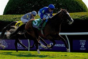 LEXINGTON, KENTUCKY - NOVEMBER 04: Jockey William Buck rides Mischief Magic to win the Breeders