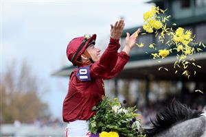 LEXINGTON, KENTUCKY - NOVEMBER 05: Jockey Tyler Gaffalione celebrates after riding Caravel to win the Breeders