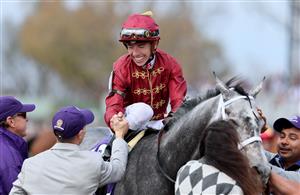 LEXINGTON, KENTUCKY - NOVEMBER 05: Jockey Tyler Gaffalione celebrates after riding Caravel to win the Breeders