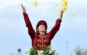LEXINGTON, KENTUCKY - NOVEMBER 05: Jockey Tyler Gaffalione celebrates after riding Caravel to win the Breeders