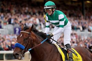 LEXINGTON, KENTUCKY - NOVEMBER 05: Jockey Flavien Prat rides Flightline to win the Longines Breeders