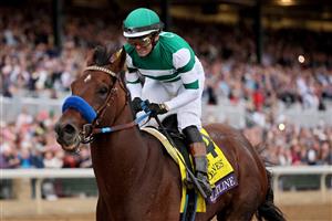 LEXINGTON, KENTUCKY - NOVEMBER 05: Jockey Flavien Prat rides Flightline to win the Longines Breeders