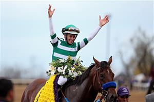 LEXINGTON, KENTUCKY - NOVEMBER 05: Jockey Flavien Prat celebrates after riding Flightline to win the Longines Breeders