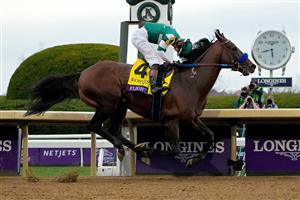 LEXINGTON, KENTUCKY - NOVEMBER 05: Jockey Flavien Prat rides Flightline to win the Longines Breeders