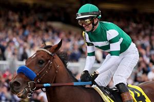 LEXINGTON, KENTUCKY - NOVEMBER 05: Jockey Flavien Prat rides Flightline to win the Longines Breeders