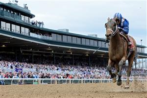 LEXINGTON, KENTUCKY - NOVEMBER 05: Jockey John Velazquez rides Malathaat to win the Longines Breeders