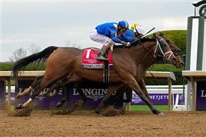 LEXINGTON, KENTUCKY - NOVEMBER 05: Jockey John Velazquez rides Malathaat to win the Longines Breeders