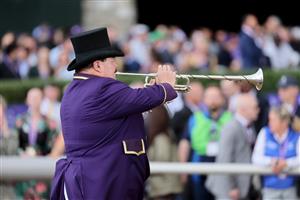 LEXINGTON, KENTUCKY - NOVEMBER 05: The track bugler performs during the 2022 Breeders