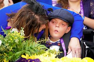 LEXINGTON, KENTUCKY - NOVEMBER 05: Leslie Dorman comforts her son Cody in the winner