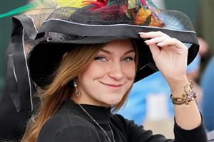LEXINGTON, KENTUCKY - NOVEMBER 05: A patron smiles during the 2022 Breeders