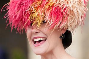 LEXINGTON, KENTUCKY - NOVEMBER 05: A patron smiles during the 2022 Breeders