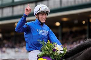 LEXINGTON, KENTUCKY - NOVEMBER 05: Jockey William Buick celebrates after riding Modern Games to win the FanDuel Breeders