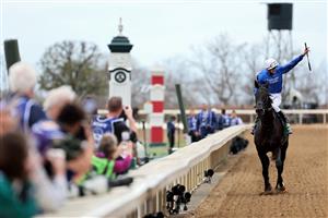LEXINGTON, KENTUCKY - NOVEMBER 05: Jockey William Buick celebrates after riding Modern Games to win the FanDuel Breeders