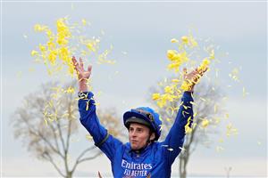 LEXINGTON, KENTUCKY - NOVEMBER 05: Jockey William Buick celebrates after riding Modern Games to win the FanDuel Breeders