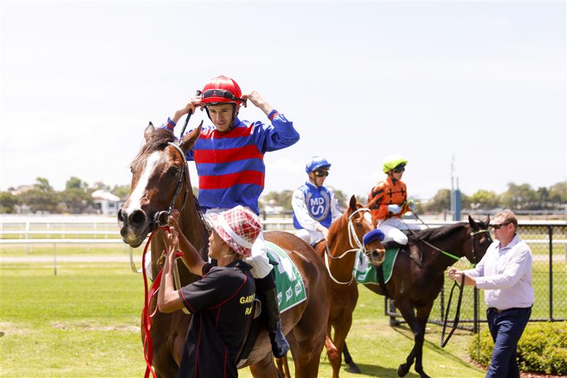 NEWCASTLE, AUSTRALIA - NOVEMBER 12: Jason Collett returns to scale after winning race 2, the TAB Highway Handicap during Racing at Newcastle Racecourse on November 12, 2022 in Newcastle, Australia. (Getty)