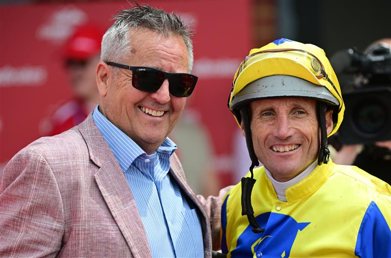 CRANBOURNE, AUSTRALIA - NOVEMBER 12: Damien Oliver poses with trainer Lindsey Smith after riding Kissinger to win Race 3, the Reed Cranes & Transport Marathon, during Melbourne Racing on Cranbourne Cup Day at Cranbourne Racecourse on November 12, 2022 in Cranbourne, Australia. (Photo by Vince Caligiuri/Getty Images)