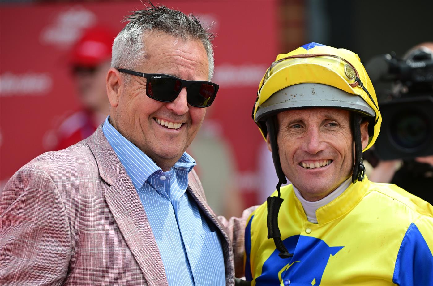 CRANBOURNE, AUSTRALIA - NOVEMBER 12: Damien Oliver poses with trainer Lindsey Smith after riding Kissinger to win Race 3, the Reed Cranes & Transport Marathon, during Melbourne Racing on Cranbourne Cup Day at Cranbourne Racecourse on November 12, 2022 in Cranbourne, Australia. (Photo by Vince Caligiuri/Getty Images)