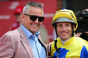 CRANBOURNE, AUSTRALIA - NOVEMBER 12: Damien Oliver poses with trainer Lindsey Smith after riding Kissinger to win Race 3, the Reed Cranes & Transport Marathon, during Melbourne Racing on Cranbourne Cup Day at Cranbourne Racecourse on November 12, 2022 in Cranbourne, Australia. (Photo by Vince Caligiuri/Getty Images)