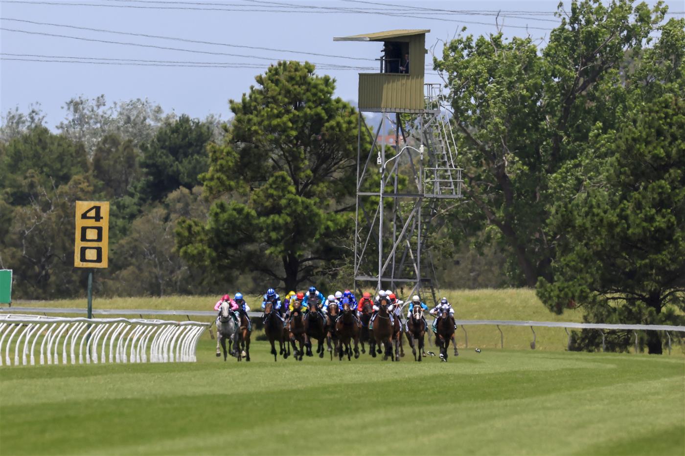 KEMBLA GRANGE, AUSTRALIA - NOVEMBER 19: Horses and jockeys round the bend for race 1 the Tab Highway Handicap during Sydney Racing at Kembla Grange Racecourse on November 19, 2022 in Kembla Grange, Australia. (Photo by Mark Evans/Getty Images)