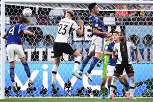 Japan defender Kou Itakura and Germany defender Nico Schlotterbeck jump for a header (Getty Images)
