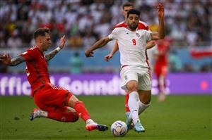 Wales defender Rodon fights for the ball with Iran forward Mehdi Taremi (Getty Images)