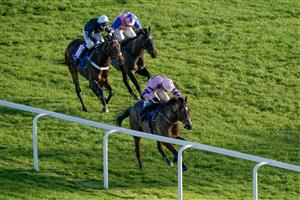 NEWBURY, ENGLAND - NOVEMBER 25: Harry Cobden riding Stay Away Fay clear the last to win The Coral Get Closer To The Action Novices