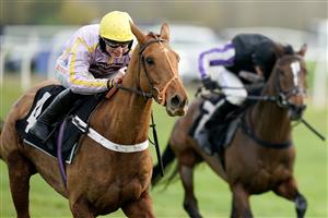 NEWBURY, ENGLAND - NOVEMBER 26: James Bowen riding Luccia clear the last to win The Play Coral