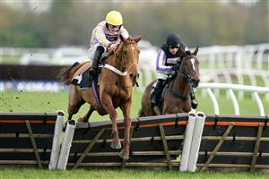 NEWBURY, ENGLAND - NOVEMBER 26: James Bowen riding Luccia clear the last to win The Play Coral