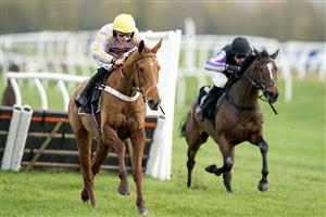 NEWBURY, ENGLAND - NOVEMBER 26: James Bowen riding Luccia clear the last to win The Play Coral