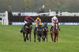 NEWBURY, ENGLAND - NOVEMBER 26: James Bowen riding First Street (maroon) clear the last to win The Coral Bet Bundles Intermediate Handicap Hurdle at Newbury Racecourse on November 26, 2022 in Newbury, England. (Photo by Alan Crowhurst/Getty Images)