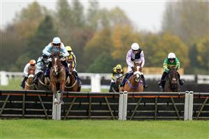 NEWBURY, ENGLAND - NOVEMBER 26: Harry Cobden riding Red Risk clear the last to win The Coral Racing Club Handicap Hurdle at Newbury Racecourse on November 26, 2022 in Newbury, England. (Photo by Alan Crowhurst/Getty Images)