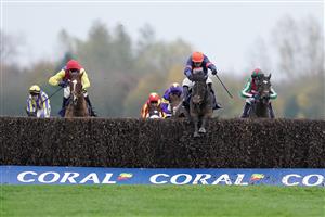 NEWBURY, ENGLAND - NOVEMBER 26: Harry Skelton riding Le Milos (orange cap) clear the last to win The Coral Gold Cup Handicap Chase at Newbury Racecourse on November 26, 2022 in Newbury, England. (Photo by Alan Crowhurst/Getty Images)
