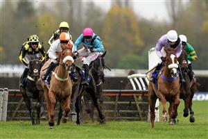 NEWBURY, ENGLAND - NOVEMBER 26: Jockey Paddy Brennan manages to stay onboard Peking Rose after a mistake during The Coral Racing Club Handicap Hurdle at Newbury Racecourse on November 26, 2022 in Newbury, England. (Photo by Alan Crowhurst/Getty Images)