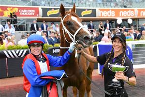 MELBOURNE, AUSTRALIA - NOVEMBER 26: Craig Williams riding Vienna Princess after winning Race 4, the Quayclean Twilight Glow Stakes, during Melbourne Racing at Caulfield Racecourse on November 26, 2022 in Melbourne, Australia. (Photo by Vince Caligiuri/Getty Images)