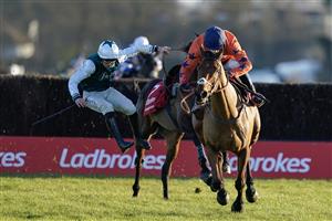 SUNBURY, ENGLAND - DECEMBER 26: Harry Cobden riding Bravemansgame (orange) clear the last to win The Ladbrokes King George VI Chase as Charlie Deutsch is unseated from L'Homme Presse at Kempton Park Racecourse on December 26, 2022 in Sunbury, England. (Photo by Alan Crowhurst/Getty Images)
