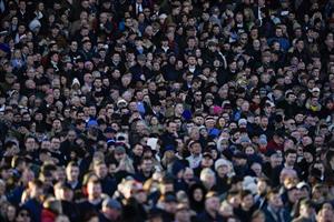 SUNBURY, ENGLAND - DECEMBER 26: A large crowd at Kempton Park Racecourse on December 26, 2022 in Sunbury, England. (Photo by Alan Crowhurst/Getty Images)