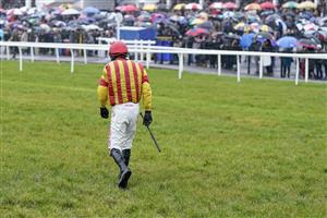 CHEPSTOW, WALES - DECEMBER 27: Paddy Brennan walks back after falling from Fils De Roi at Chepstow Racecourse on December 27, 2022 in Chepstow, Wales. (Photo by Alan Crowhurst/Getty Images)