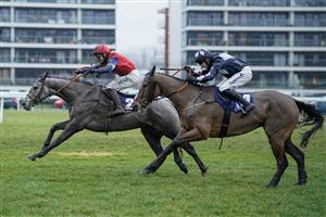NEWBURY, ENGLAND - DECEMBER 31: Bryan Carver riding Grumpy Charley (L) clear the last to win The Coral Racing Club Mandarin Handicap Chase at Newbury Racecourse on December 31, 2022 in Newbury, England. (Photo by Alan Crowhurst/Getty Images)