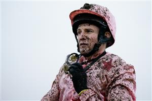NEWBURY, ENGLAND - DECEMBER 31: Jamie Moore on a muddy day at Newbury Racecourse on December 31, 2022 in Newbury, England. (Photo by Alan Crowhurst/Getty Images)