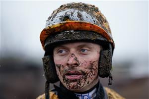 NEWBURY, ENGLAND - DECEMBER 31: James Bowen on a muddy day at Newbury Racecourse on December 31, 2022 in Newbury, England. (Photo by Alan Crowhurst/Getty Images)