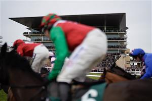 CHELTENHAM, ENGLAND - JANUARY 01: A general view as runners pass the grandstands during The AIS Handicap Chase at Cheltenham Racecourse on January 01, 2023 in Cheltenham, England. (Photo by Alan Crowhurst/Getty Images)