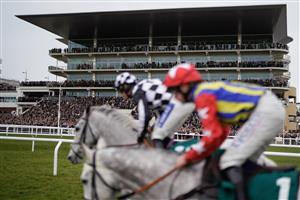 CHELTENHAM, ENGLAND - JANUARY 01: A general view as runners pass the grandstands during The AIS Handicap Chase at Cheltenham Racecourse on January 01, 2023 in Cheltenham, England. (Photo by Alan Crowhurst/Getty Images)