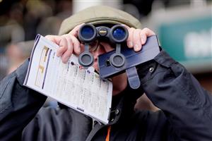 CHELTENHAM, ENGLAND - JANUARY 01: Watching the action at Cheltenham Racecourse on January 01, 2023 in Cheltenham, England. (Photo by Alan Crowhurst/Getty Images)